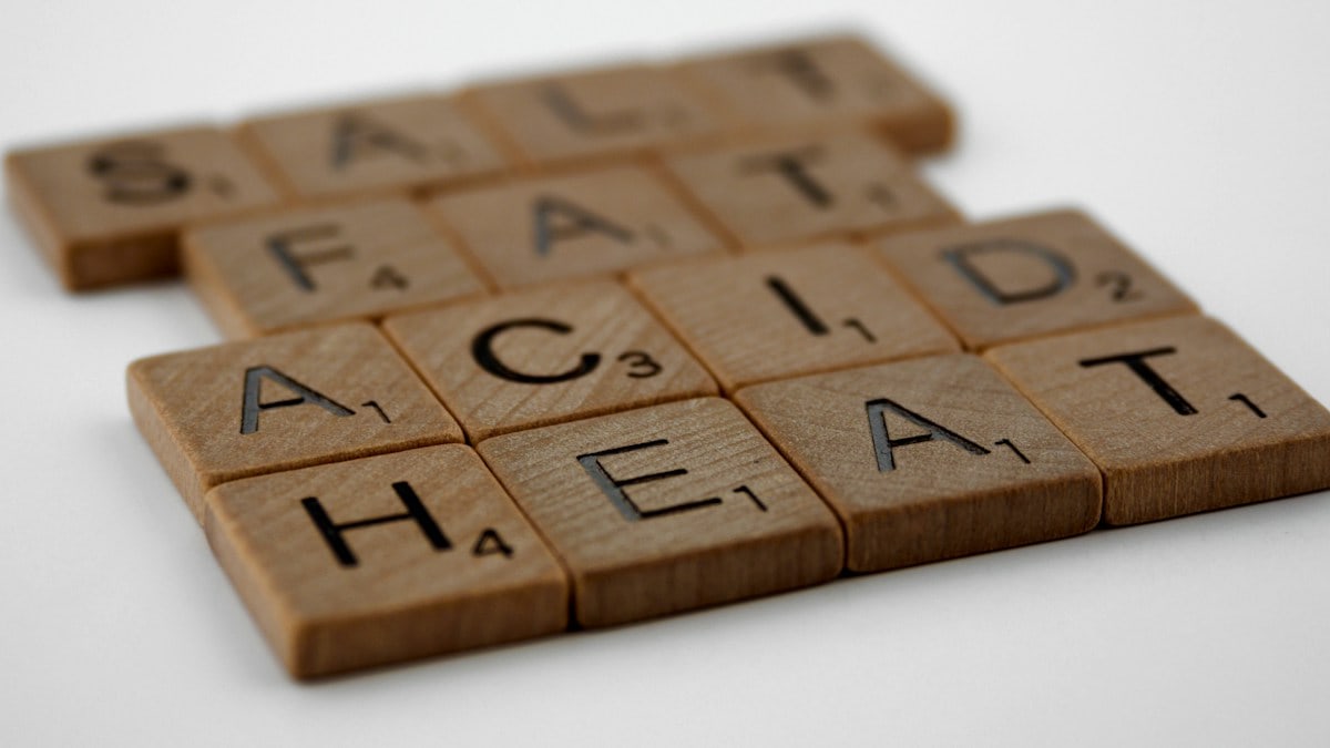 scrabble, scrabble pieces, lettering, letters, wood, scrabble tiles, white background, words, salt, fat, acid, heat, cookery, cooking, cordon bleu, basics, cookery basics, samin nosrat, ingredients,